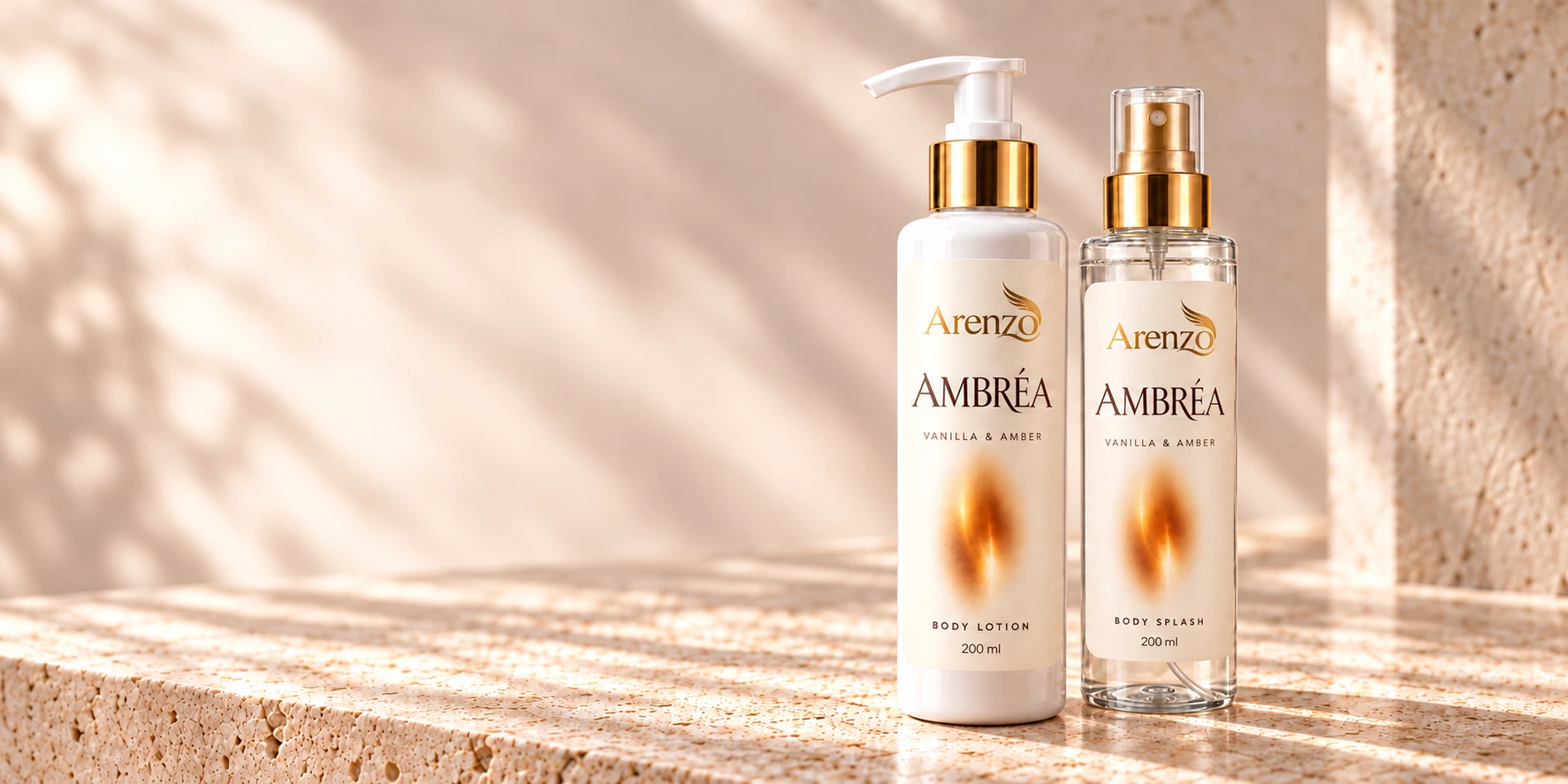 AMBRÉA Vanilla & Amber, matching body lotion & body splash on travertine